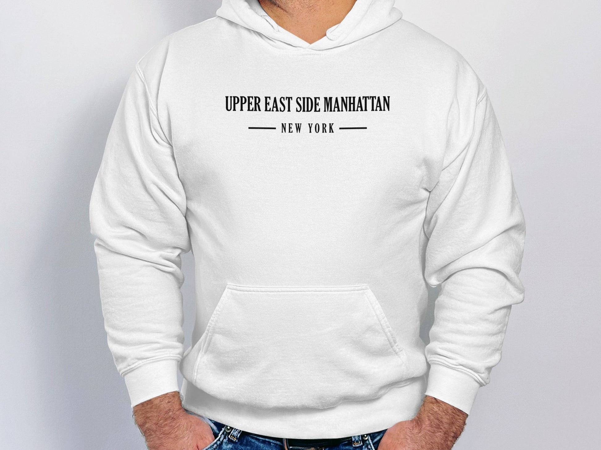  White Upper East Side Manhattan Hoodie showcasing graphic print, unisex pullover design, & long sleeves for cool days