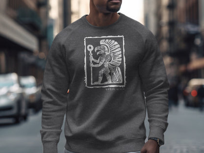 Dark heather Urban Aztec Sweatshirt Edition 3 with full-body Aztec warrior, feathered headdress, and glyph detailing at centre chest.