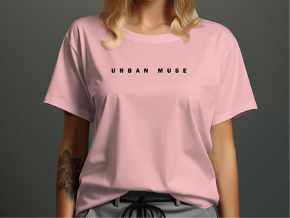 Pink Urban Muse T-Shirt showcasing the clean, minimalist widely spaced black font positioned across the front.