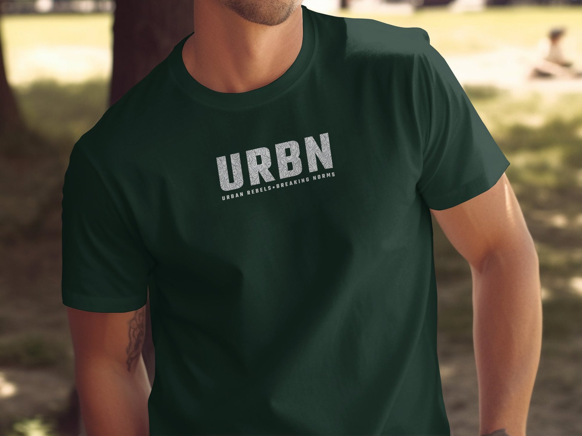 URBN T-shirt in forest green, with a standout 'Urban Rebels Breaking Norms' print, perfect for making a bold statement.