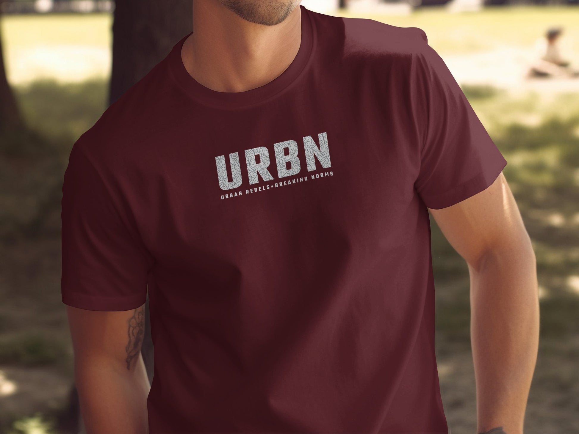 URBN T-shirt in maroon, featuring the 'Urban Rebels Breaking Norms' graphic, crafted for those who challenge conventions.