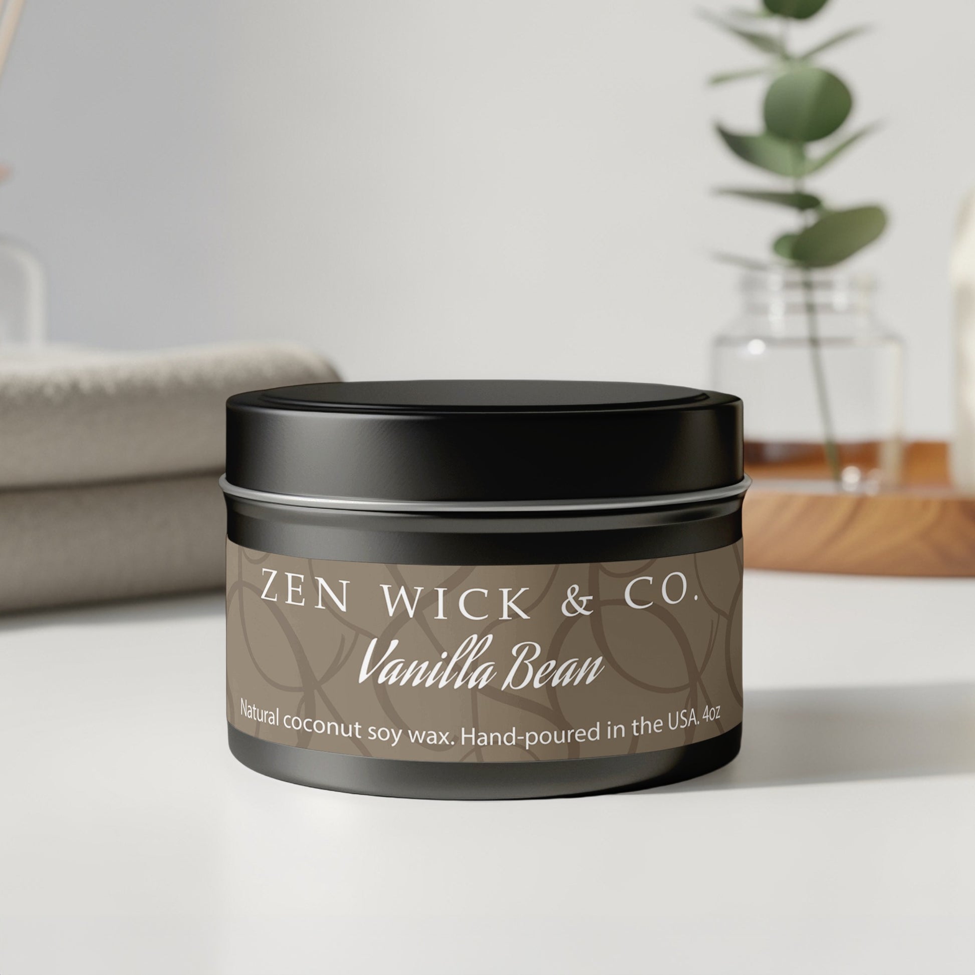 Vanilla bean scented tin candle 4oz with lid on displayed on table showcasing minimalist design and style.