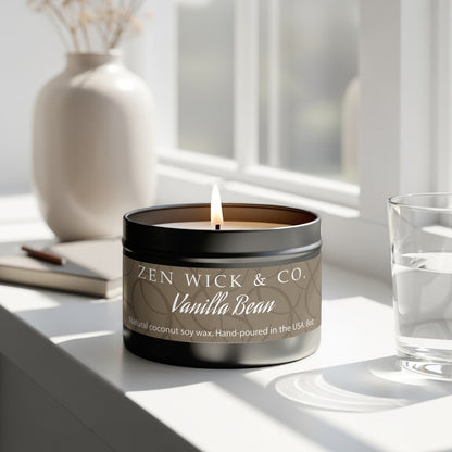 Vanilla bean scented tin candle 8oz burning beside window with natural light creating a calm relaxing mood.