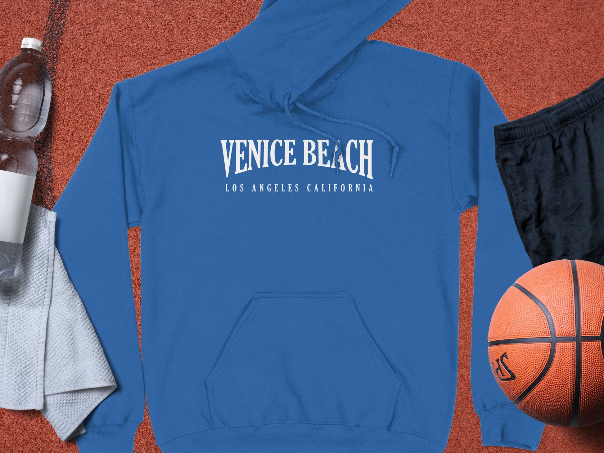Royal Blue Venice Beach Hoodie with front graphic, cozy long sleeves, and a relaxed unisex fit for casual style
