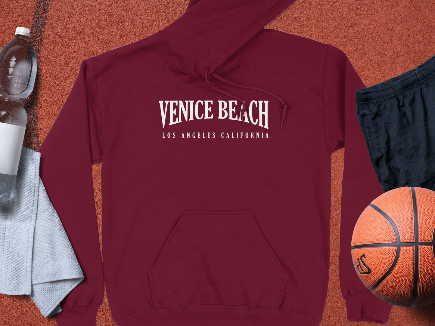 Maroon Venice Beach Hoodie with printed graphic, unisex design, and cozy long sleeve pullover style