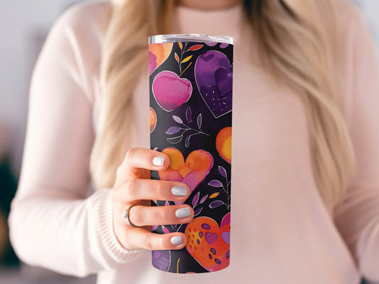 Wrap-around heart tumbler showcasing bold pastel hearts with blooming pigments and floral leaf accents.
