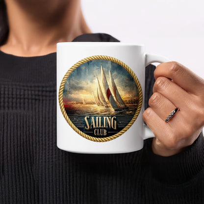 Woman holding Vintage Sailing Club 11oz mug featuring rope-framed maritime emblem and sailing yachts.