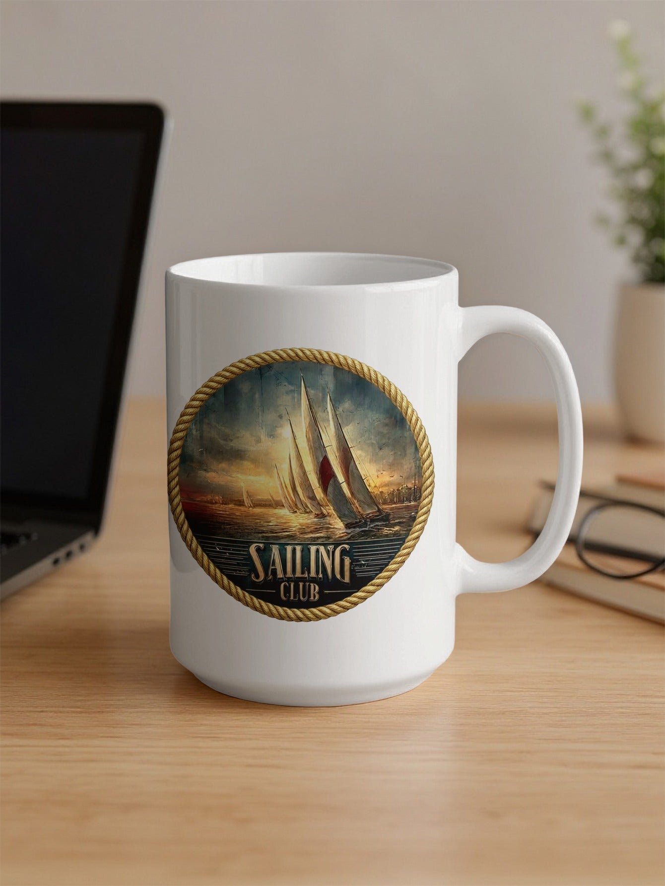Sailing Club 15oz coffee mug on office desk featuring vintage maritime sailing emblem and glossy finish with handle.