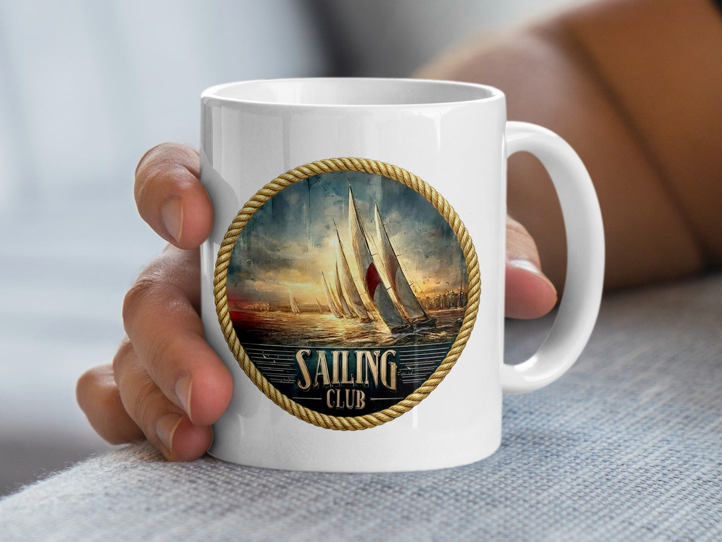 Hand holding Vintage Sailing Club ceramic mug 11oz with nautical sailing yacht artwork and glossy finish.