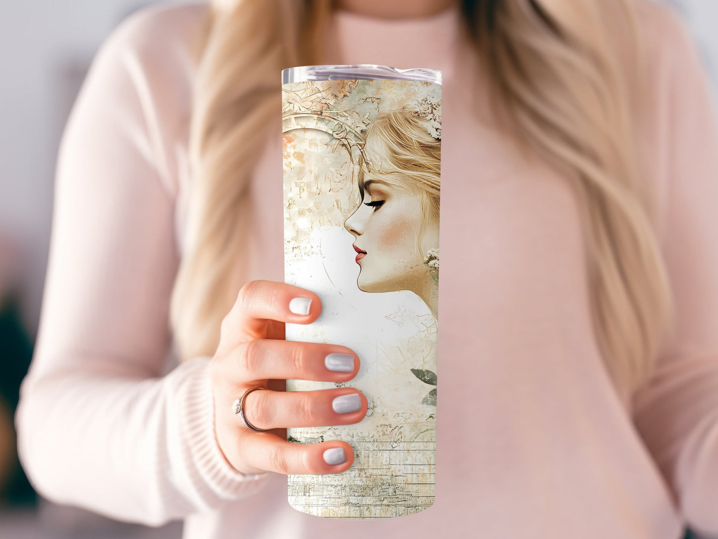 Model holding vintage woman tumbler, slim 20oz design with metal straw and classic vintage woman’s portrait