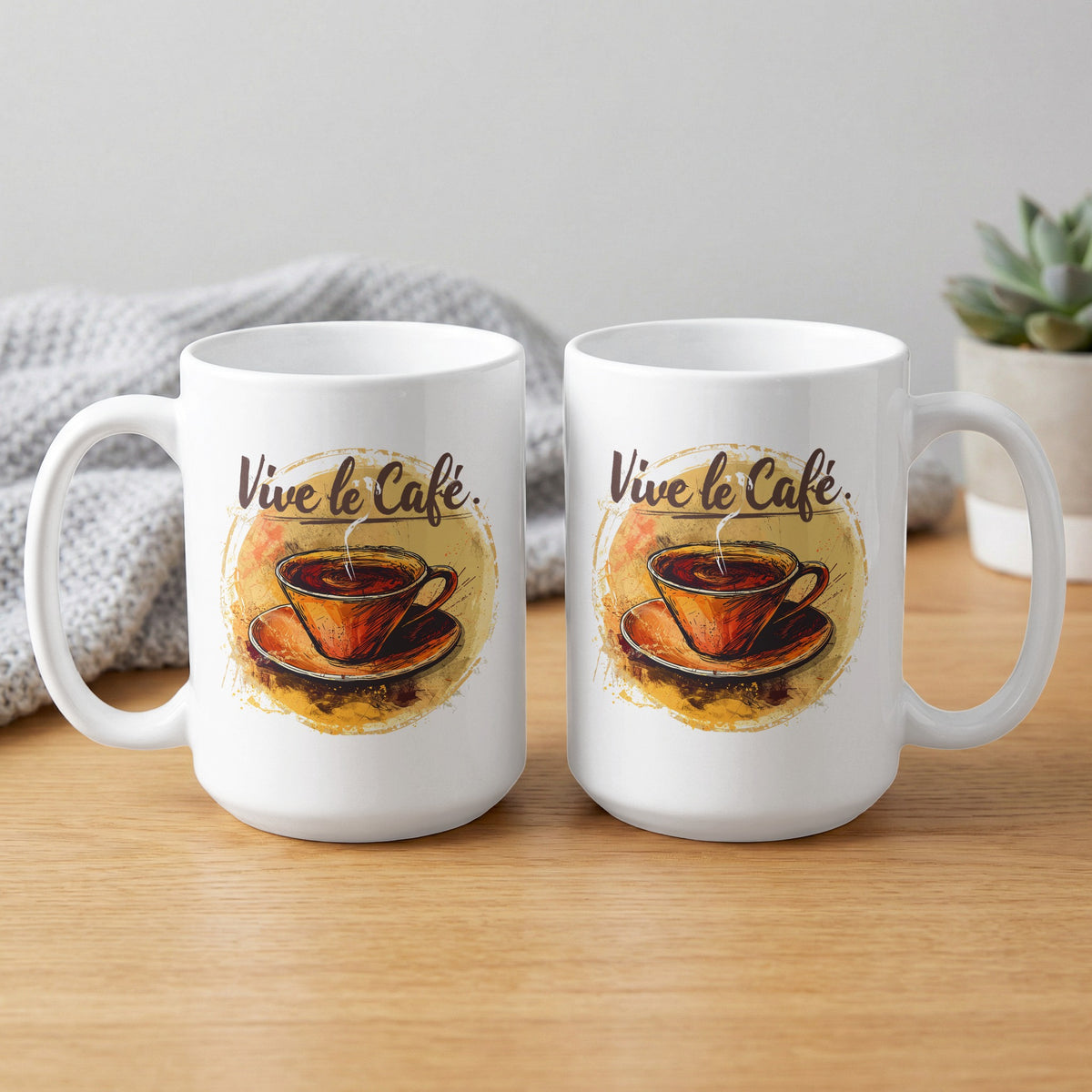 Two 15oz Vive le Cafe Watercolour coffee mugs showing front and back with hand-drawn coffee artwork, amber wash and flowing brown lettering.