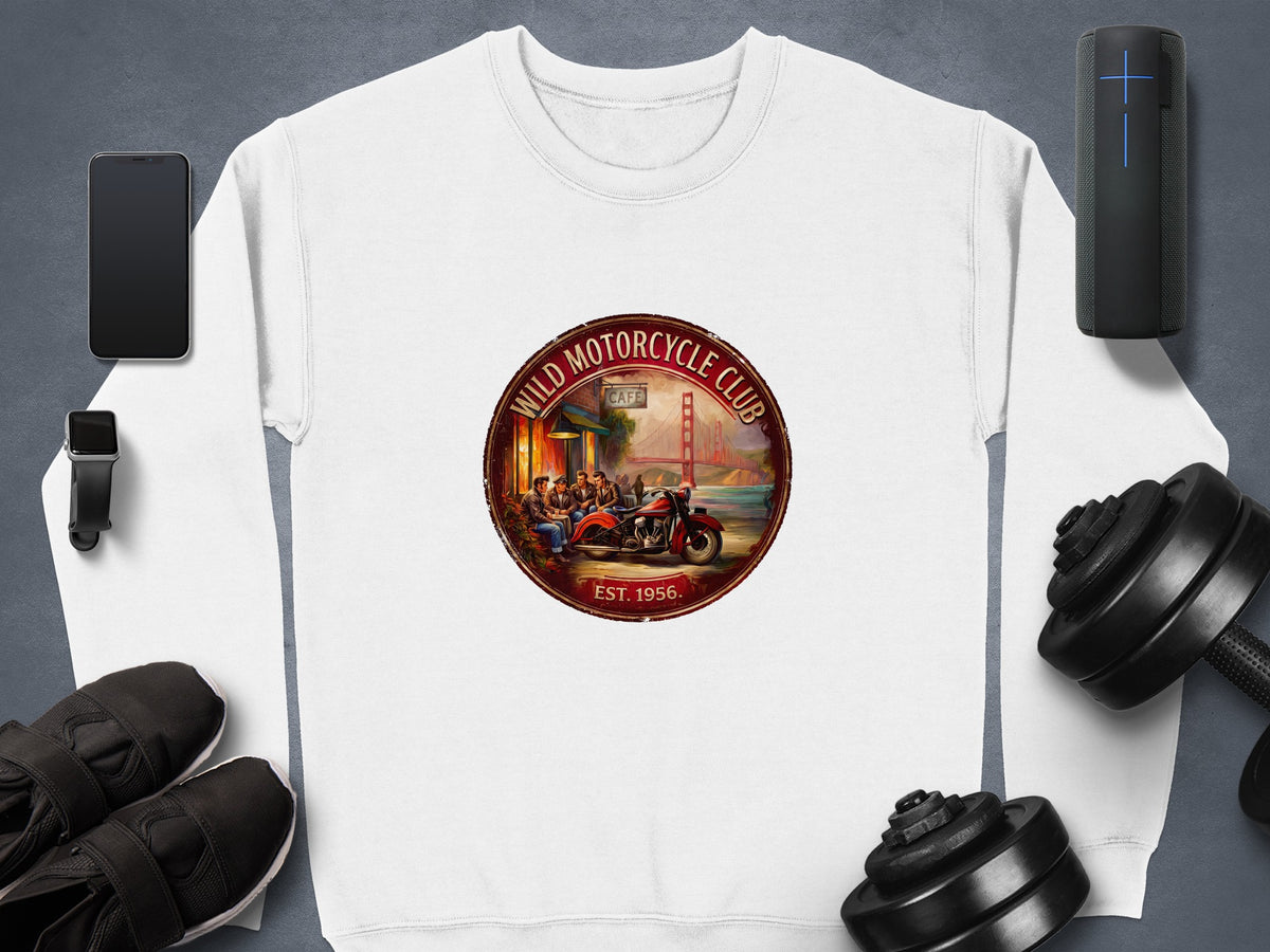 Wild Motorcycle Club white sweatshirt featuring a retro motorcycle-club badge, red vintage motorcycle and Golden Gate Bridge scenery.