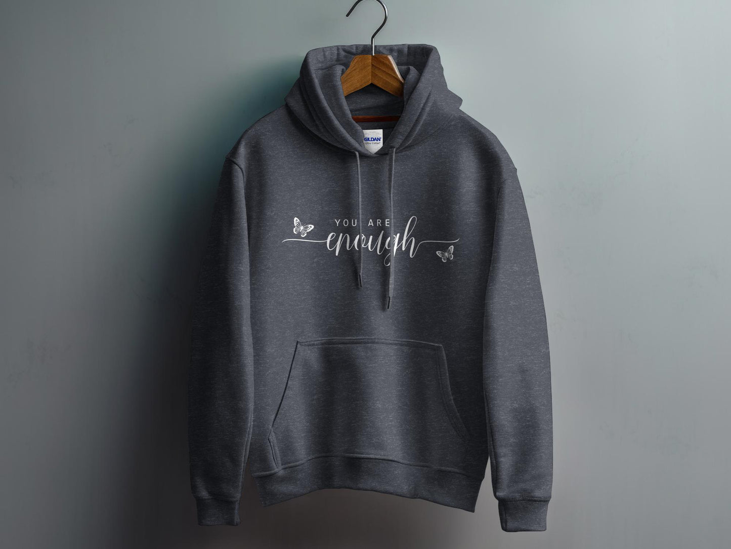 Dark Heather Grey You Are Enough Hoodie showcasing minimalist affirmation text with oversized handwritten-style enough script.