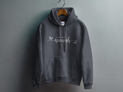 Dark Heather Grey You Are Enough Hoodie showcasing minimalist affirmation text with oversized handwritten-style enough script.